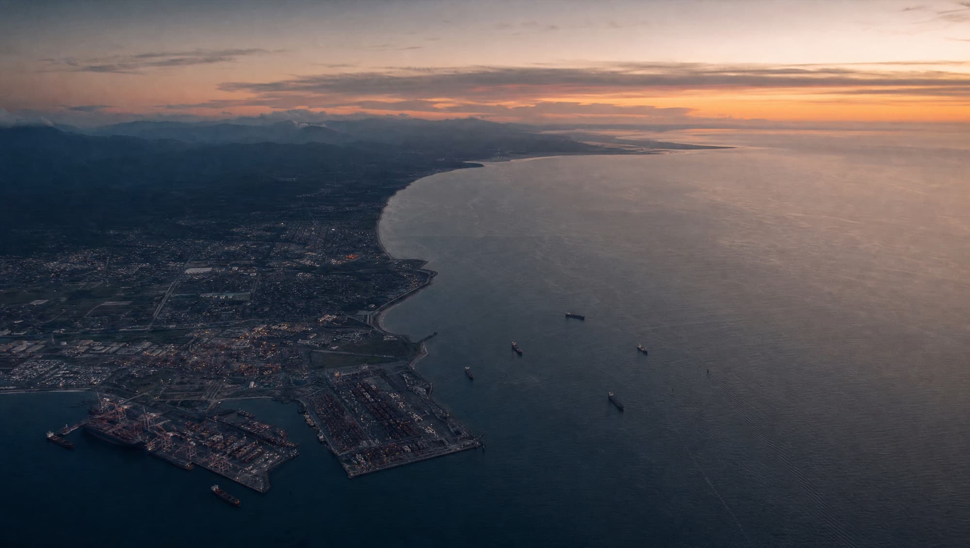 Aerial view of a working port and terminal at dusk